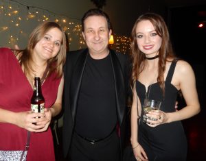 Andy performing close up magic at a Swindon party with two guests.