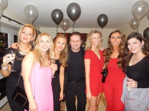 Andy surrounded by a group of guests at a party in Swindon. All enjoying the event together.