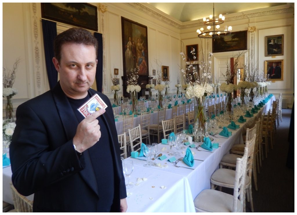 Aberystwyth Magician Gets ready to perform around tables