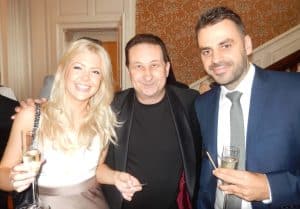 Andy with a couple at a Swindon party as they enjoy the event together