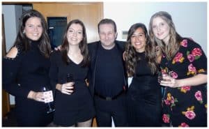 Andy Field Cheltenham party magician. Performing close up magic for a delighted group of ladies!