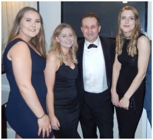 Andy Field performing close-up magic for a group at a corporate event in Swindon