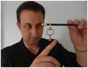 Swindon wedding magician Andy Field performing a close-up ring trick during a wedding reception.