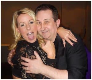 Happy guest laughing and hugging Bristol party magician Andy Field after an amazing close-up magic performance