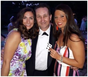 Andy Field with two ladies after a card trick in Oxford