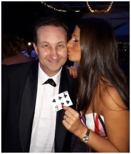 Oxford anniversary magician performing a card trick