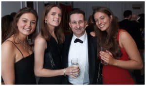 Andy Field performing close-up magic for three women