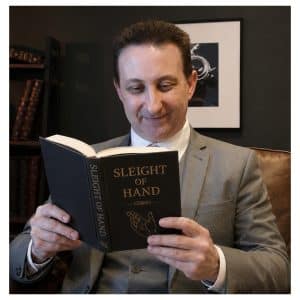 Andy Field reading a book about magic