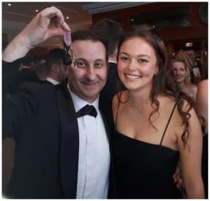 Andy Field performing a ring trick for a lady at a close-up magic event