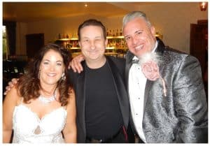Andy Field with the bride and groom after performing close-up magic in Oxford
