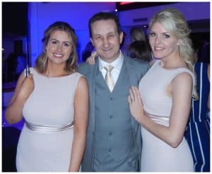 Andy Field with two impressed guests after a close-up magic performance