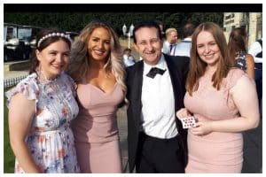 Andy Field with three girls at a wedding