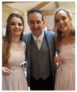 Andy Field with two bridesmaids at a Bath wedding