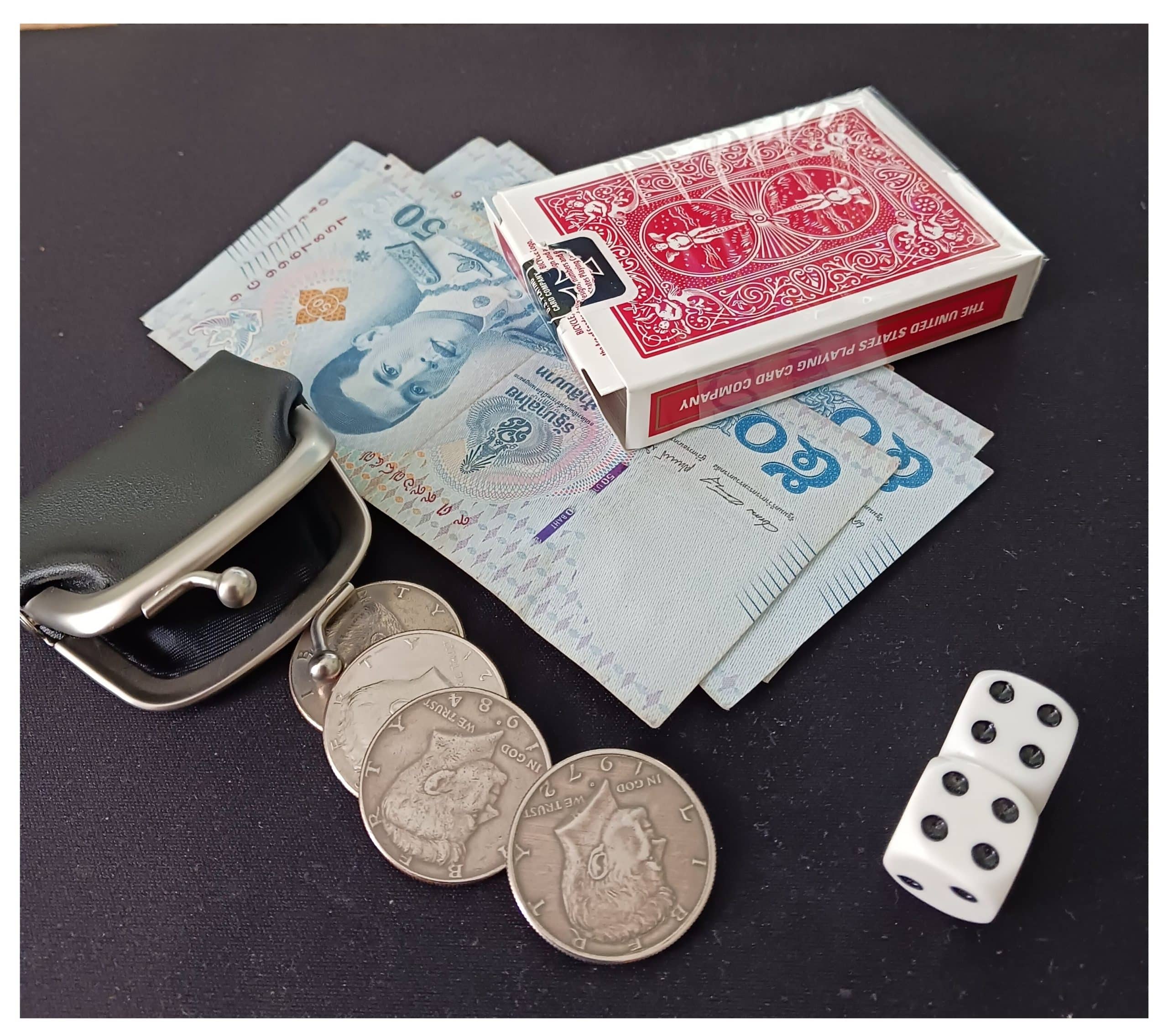 Close-Up Magic Props for magician in Bristol Playing cards, banknotes and dice used by Andy Field for close-up magic performances in and around Bristol