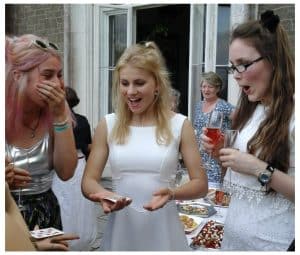 A group of guests amazed as Bristol party magician Andy Field performs an incredible close-up magic trick