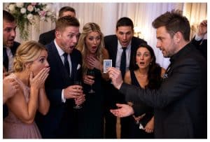 Magician performing close-up magic that amazes an audience