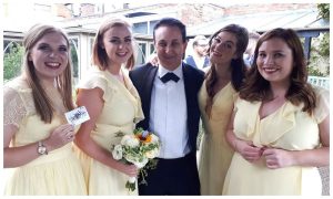 Bath magician Andy Field performing close-up magic for bridesmaids at a wedding